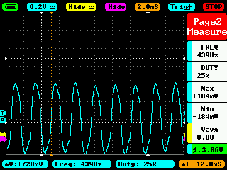 Oscilloscope showing instrument signal oscillating between positive and negative voltages.